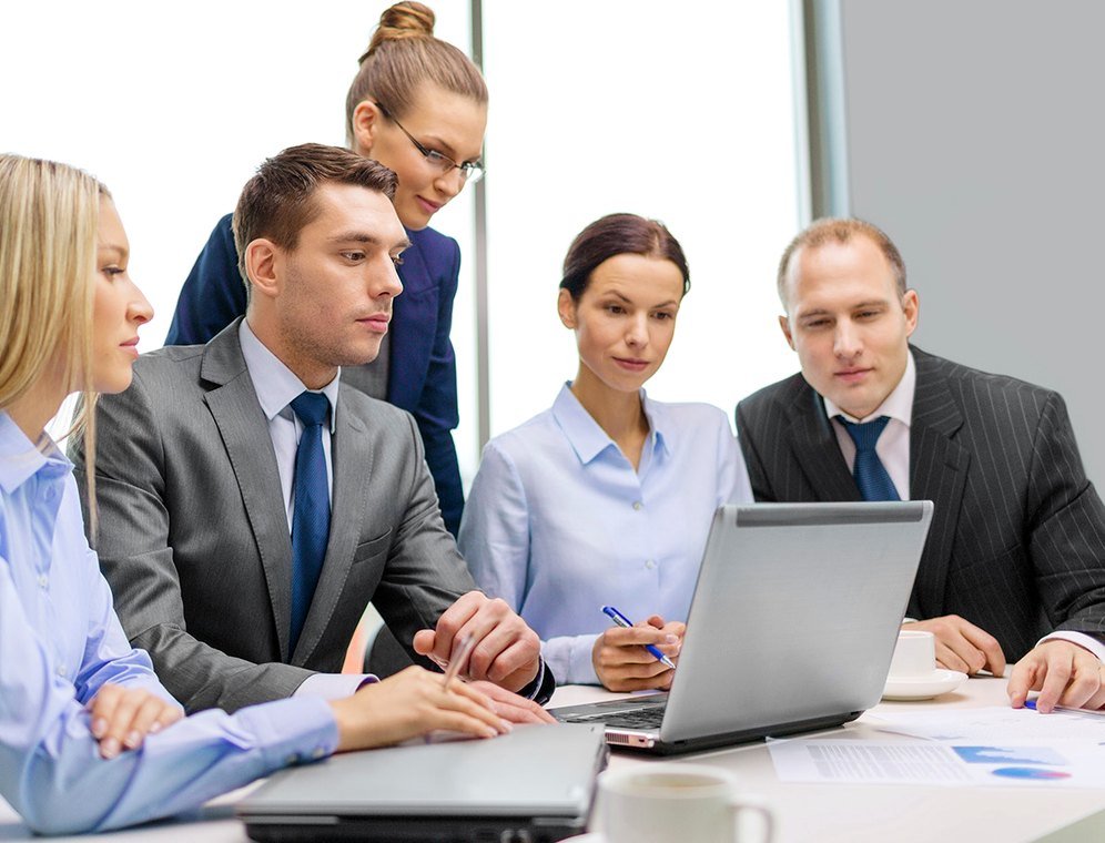 Consulting team reviewing work together